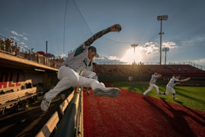 Members of the Texico High School Wolverines jump out of the dugout following the game against the Eunice High School Cardinals in the NMAA Baseball State Division 2A Championships at Santa Ana Star Field on June 25, 2021 in Albuquerque, New Mexico. The Wolverines defeated the Cardinals 9-5 to win the state championship.